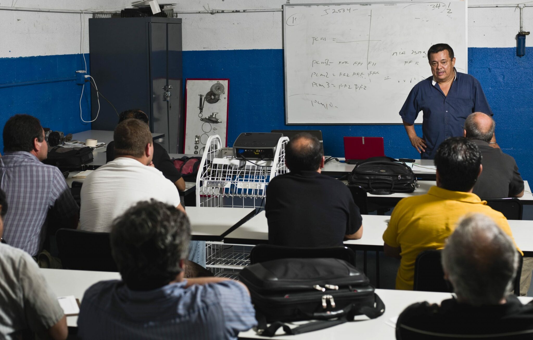 a trainer in a classroom with the mechanics